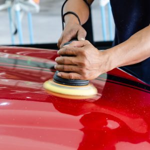 Car detailing.Man hand holding and polish the car.Polishing car wax.